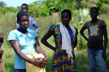 people in Uganda with water canisters
