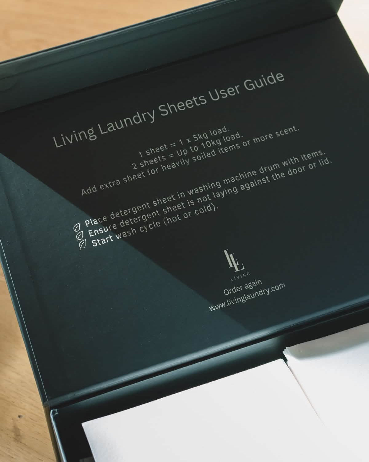 Inside of scented laundry detergent box with how to use instructions