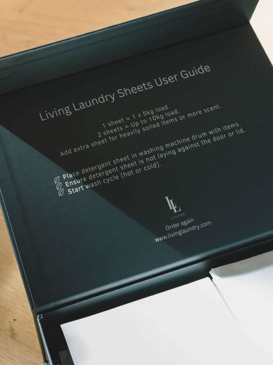 display box of travel friendly scented detergent sheets with instructions on lid