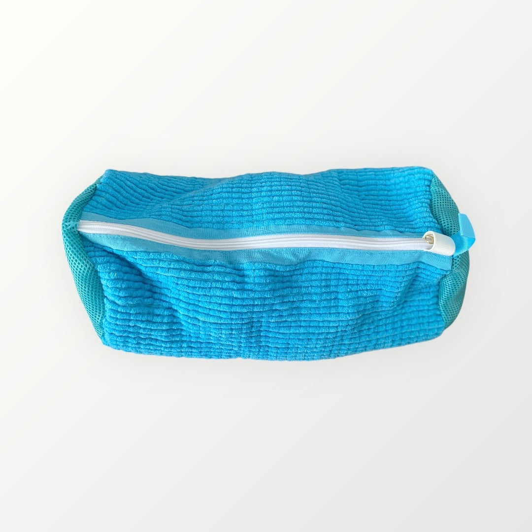 blue wash bag zipped up