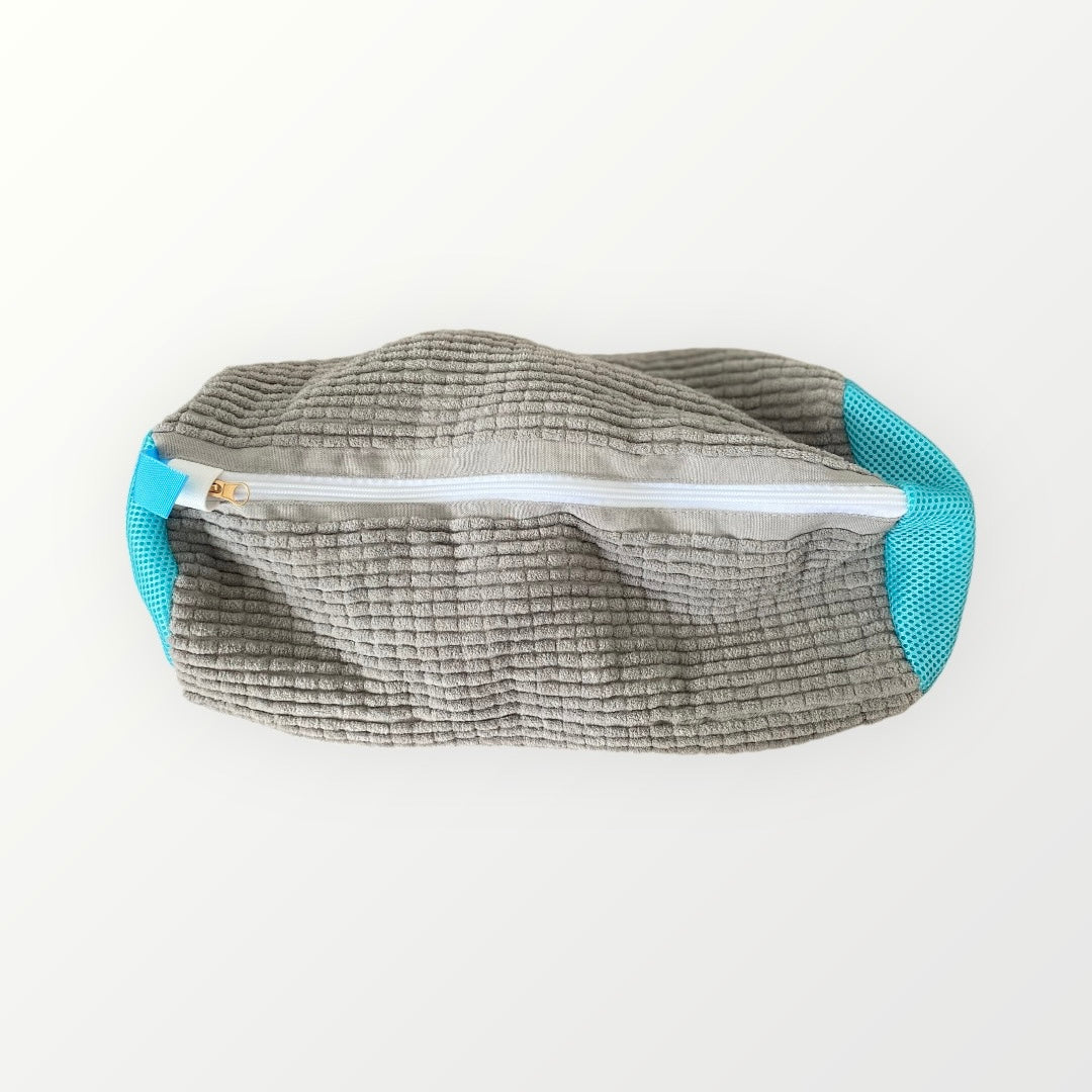 zipped up grey wash bag