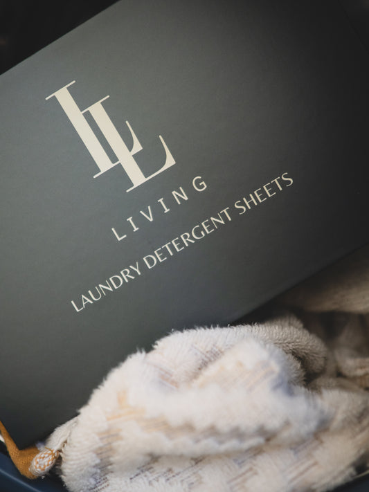 box of scented sheets in machine on top of towel