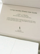 Living Laundry Sheets User Guide with instructions and branding on a beige background